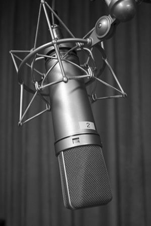 Black and white photograph of a Neumann U87 mi...